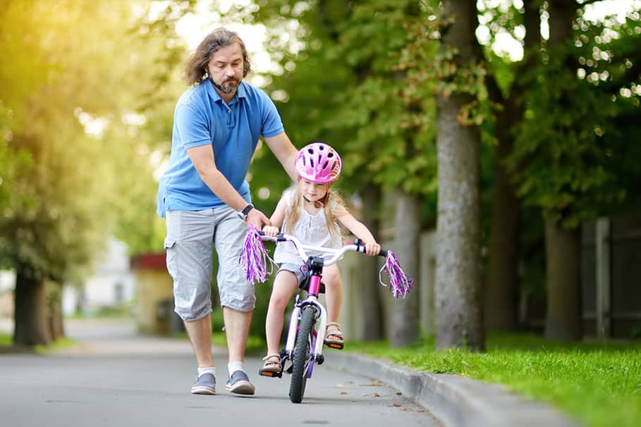 a kid riding a bike